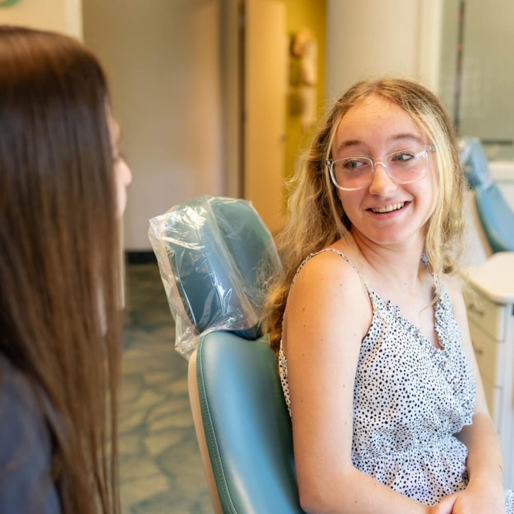 teen girl smiling during free consultation