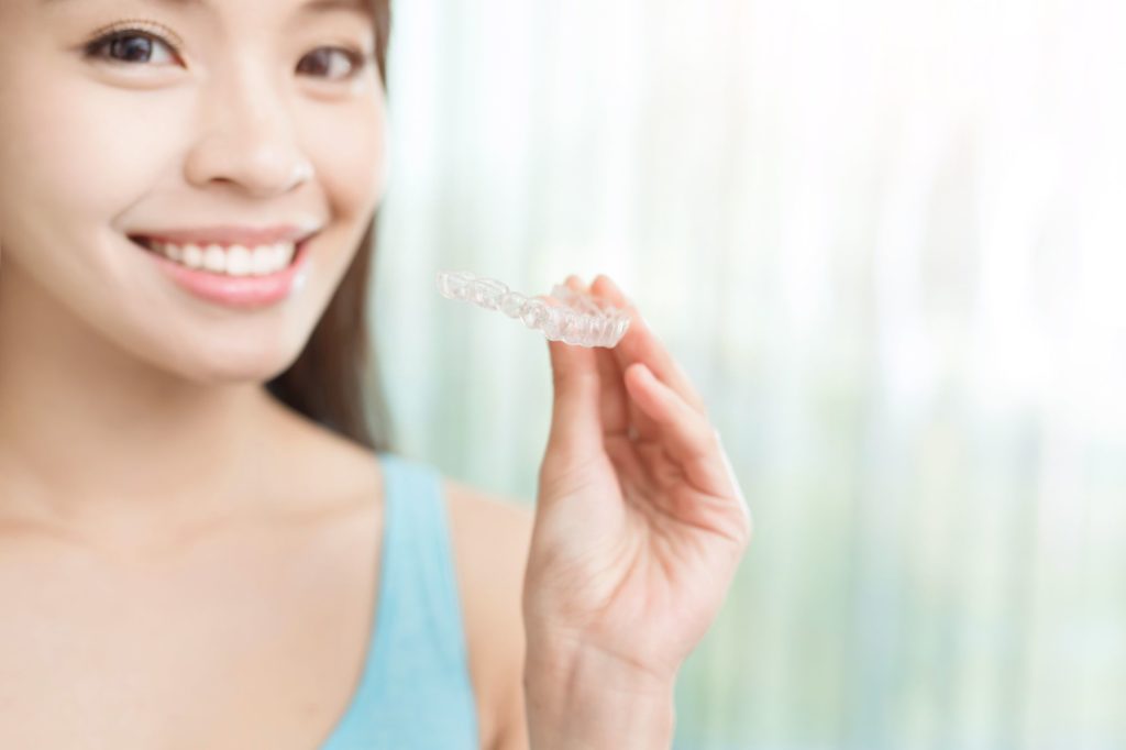 patient holding erie clear aligners