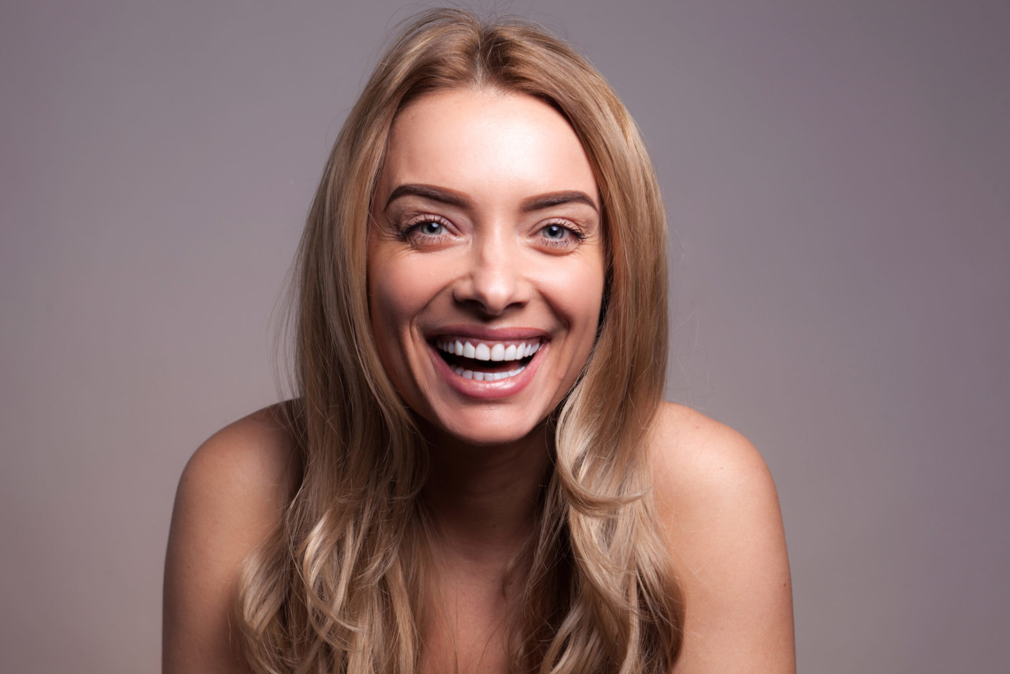 smiling patient with erie clear aligners